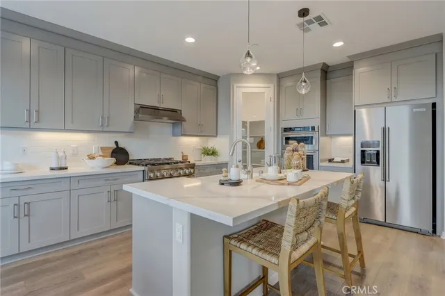 a bedroom with bed and a potted plant