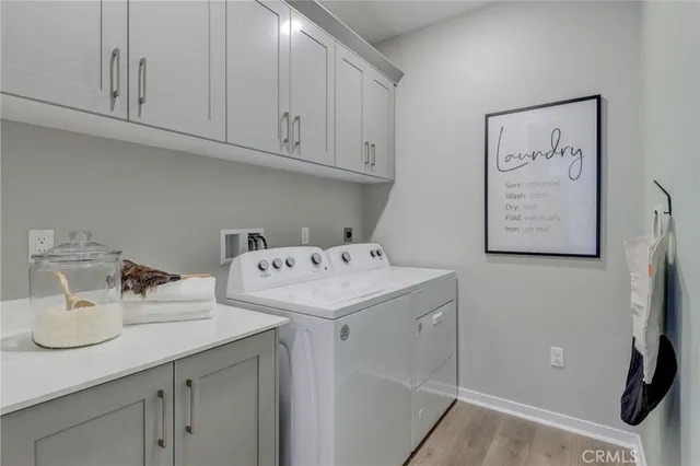 a bedroom with a bed and chandelier
