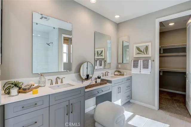 a bedroom with a bed and a closet with mirror