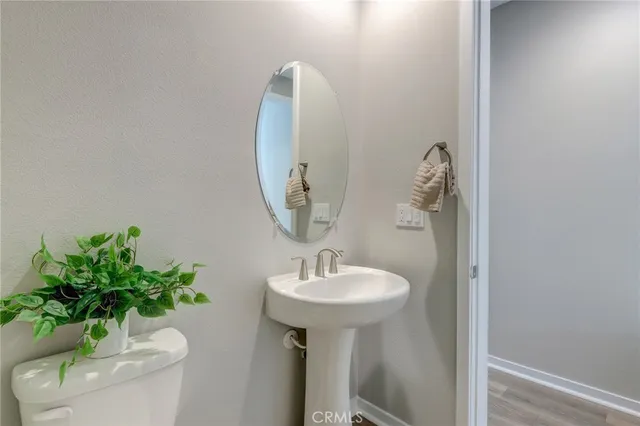 a bathroom with double sink and a mirror