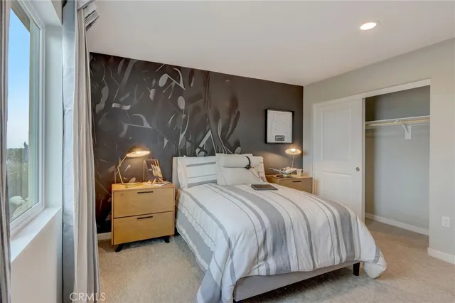 a bedroom with a bed and a table in it