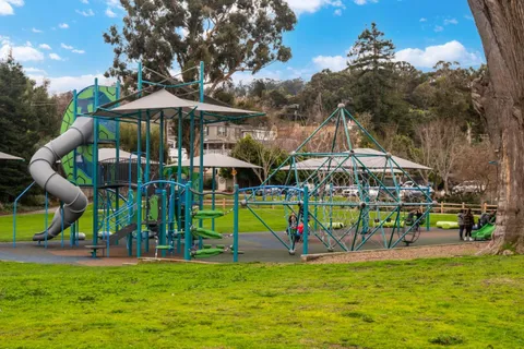 a front view of building with yard and green space