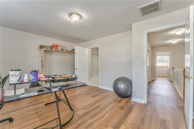 a workspace with furniture and wooden floor
