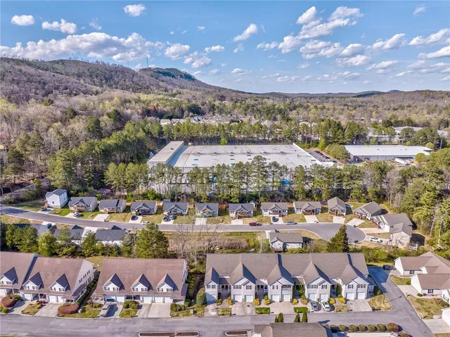 an aerial view of a residential houses and outdoor space
