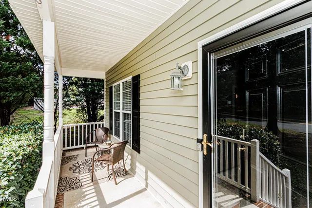 a view of a patio with a chairs and table in a patio