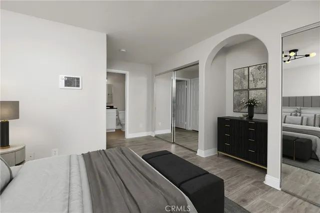 a bedroom with a bed and a dresser