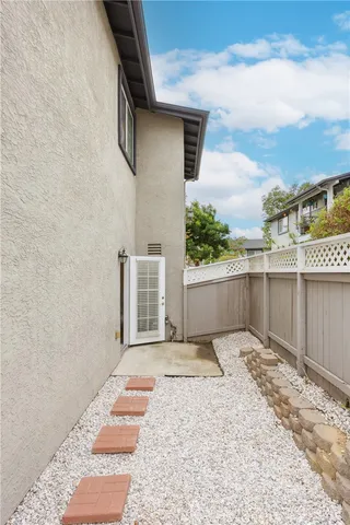 a view of a backyard of the house