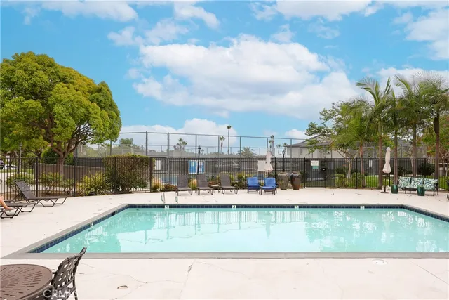 a view of yard with swimming pool