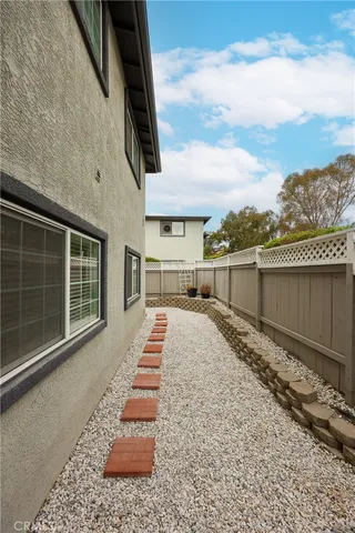 a view of a backyard with sitting area