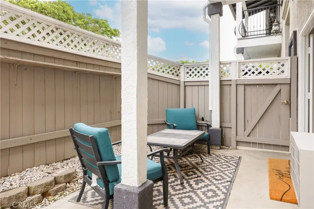 a view of a balcony with chair and table