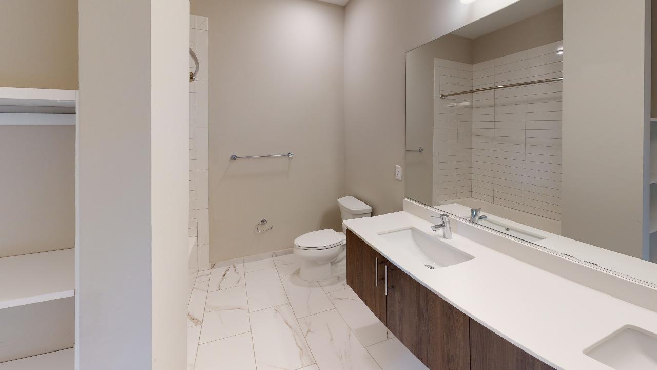 Undisclosed Address Chicago, IL 60640 - Photo 3 of 9 a bathroom with a sink a toilet and shower