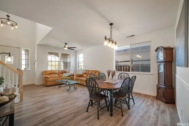 a view of a dining room with furniture window and wooden floor