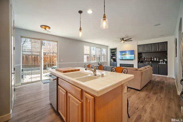 a kitchen that has a table and chairs in it
