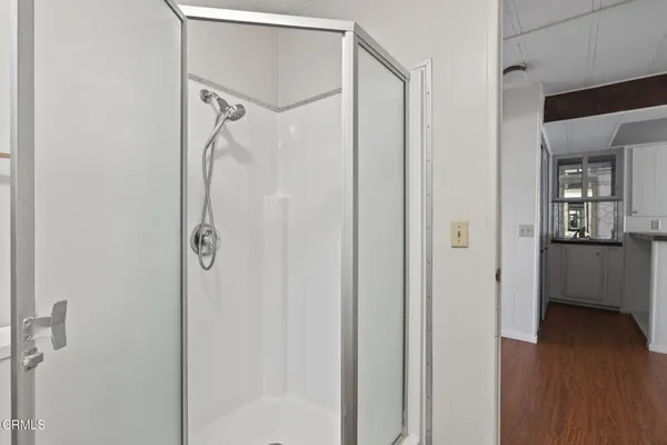 a view of a bathroom from a hallway