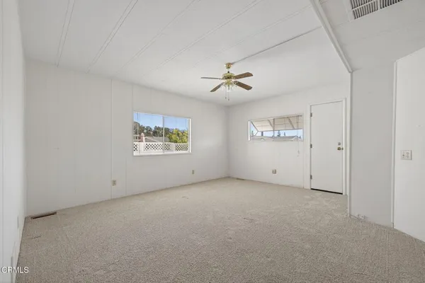 a view of an empty room with a window