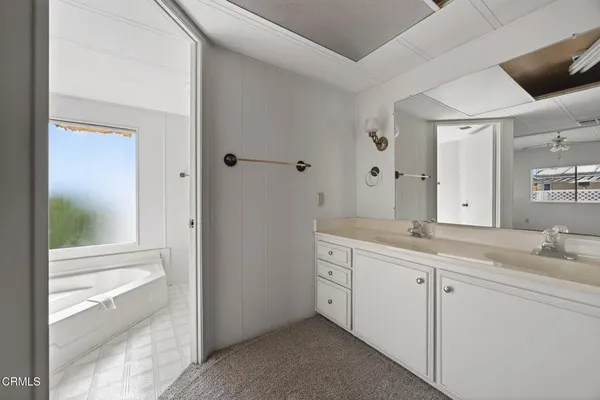 a bathroom with a sink and shower