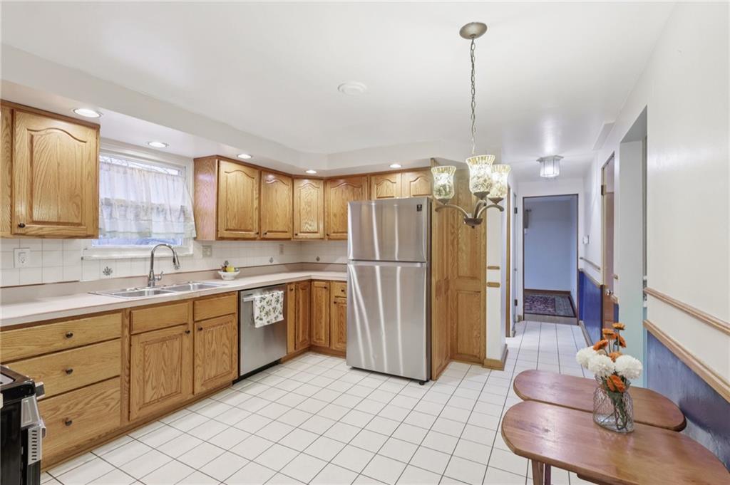 631 George Street Turtle Creek, PA 15145 - Photo 15 of 44 a bathroom with a sink a toilet and a mirror
