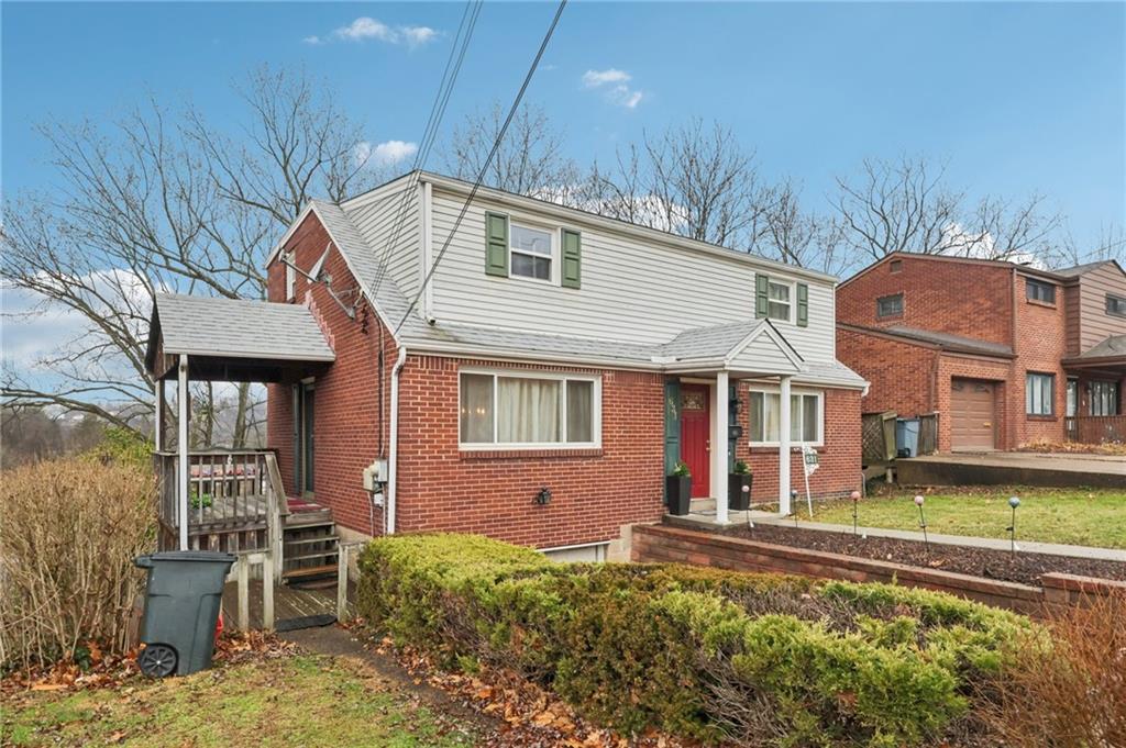 631 George Street Turtle Creek, PA 15145 - Photo 2 of 44 a front view of a house with garden