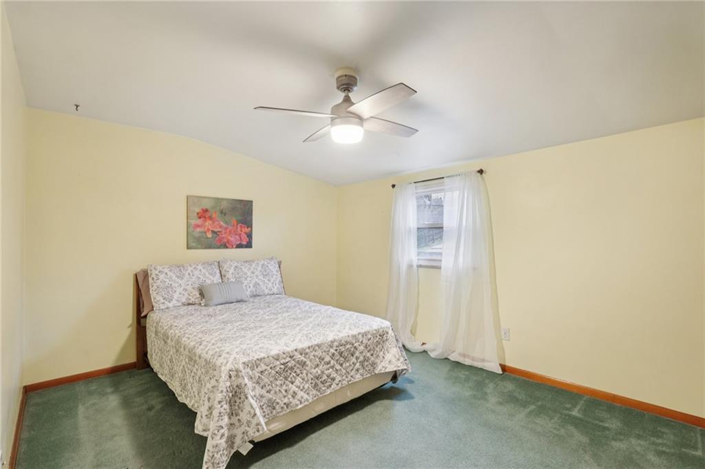631 George Street Turtle Creek, PA 15145 - Photo 22 of 44 a bedroom with a bed and a ceiling fan