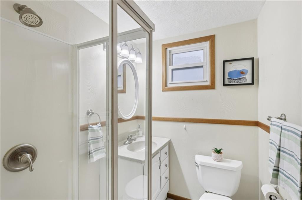 631 George Street Turtle Creek, PA 15145 - Photo 26 of 44 a bathroom with a toilet a sink and mirror