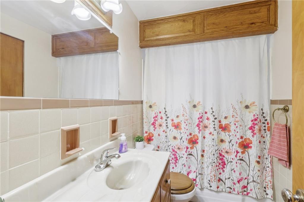 631 George Street Turtle Creek, PA 15145 - Photo 27 of 44 a bathroom with a sink and a mirror