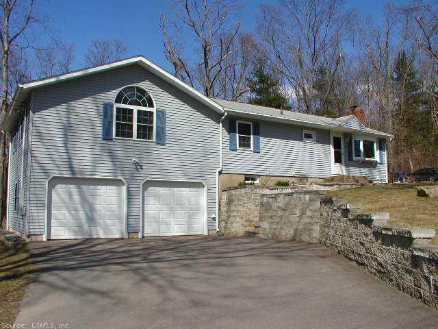 40 Brookfield Road Bolton, CT 06043 - Photo 1 of 1 a front view of a house with a yard