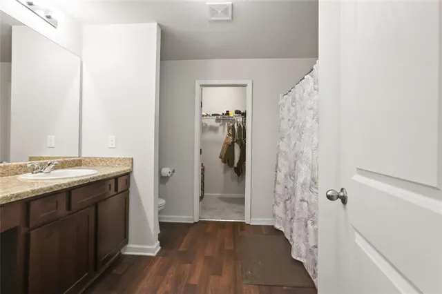 a bathroom with a sink and shower