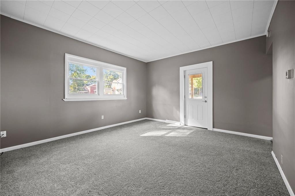 118 15th Street, Unit 1 Beaver Falls, PA 15010 - Photo 12 of 13 an empty room with windows and closet