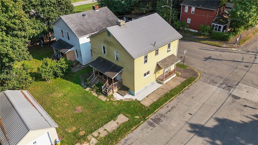 118 15th Street, Unit 1 Beaver Falls, PA 15010 - Photo 2 of 13 a aerial view of a house with a yard