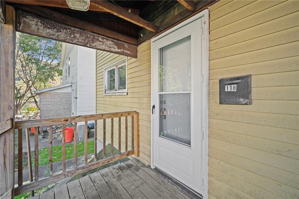 118 15th Street, Unit 1 Beaver Falls, PA 15010 - Photo 3 of 13 a view of a balcony with wooden floor