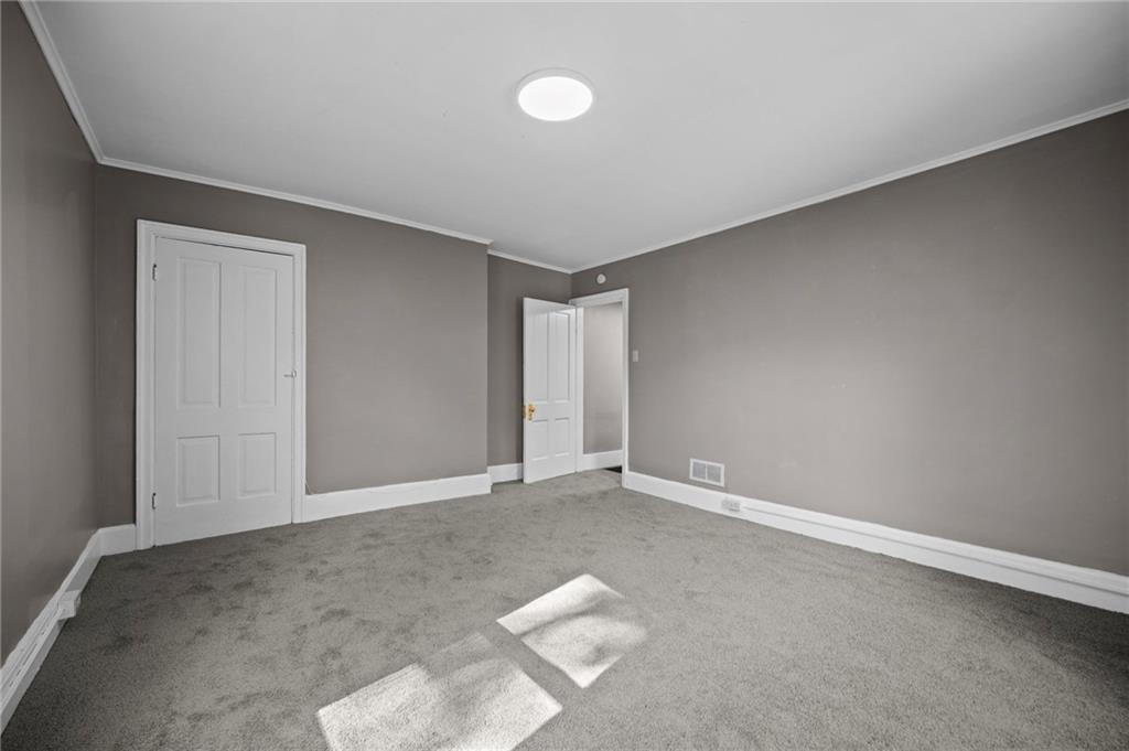 118 15th Street, Unit 1 Beaver Falls, PA 15010 - Photo 9 of 13 a view of an empty room with a window