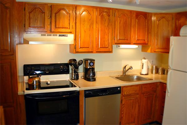 47 Leonard Road, Unit 47 Boxborough, MA 01719 - Photo 7 of 11 a kitchen with appliances cabinets and a sink