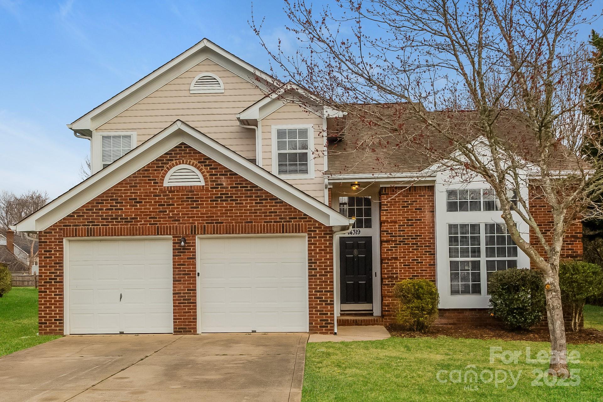 14319 Ruddy Court Charlotte, NC 28273 - Photo 2 of 16 front view of a house with a yard