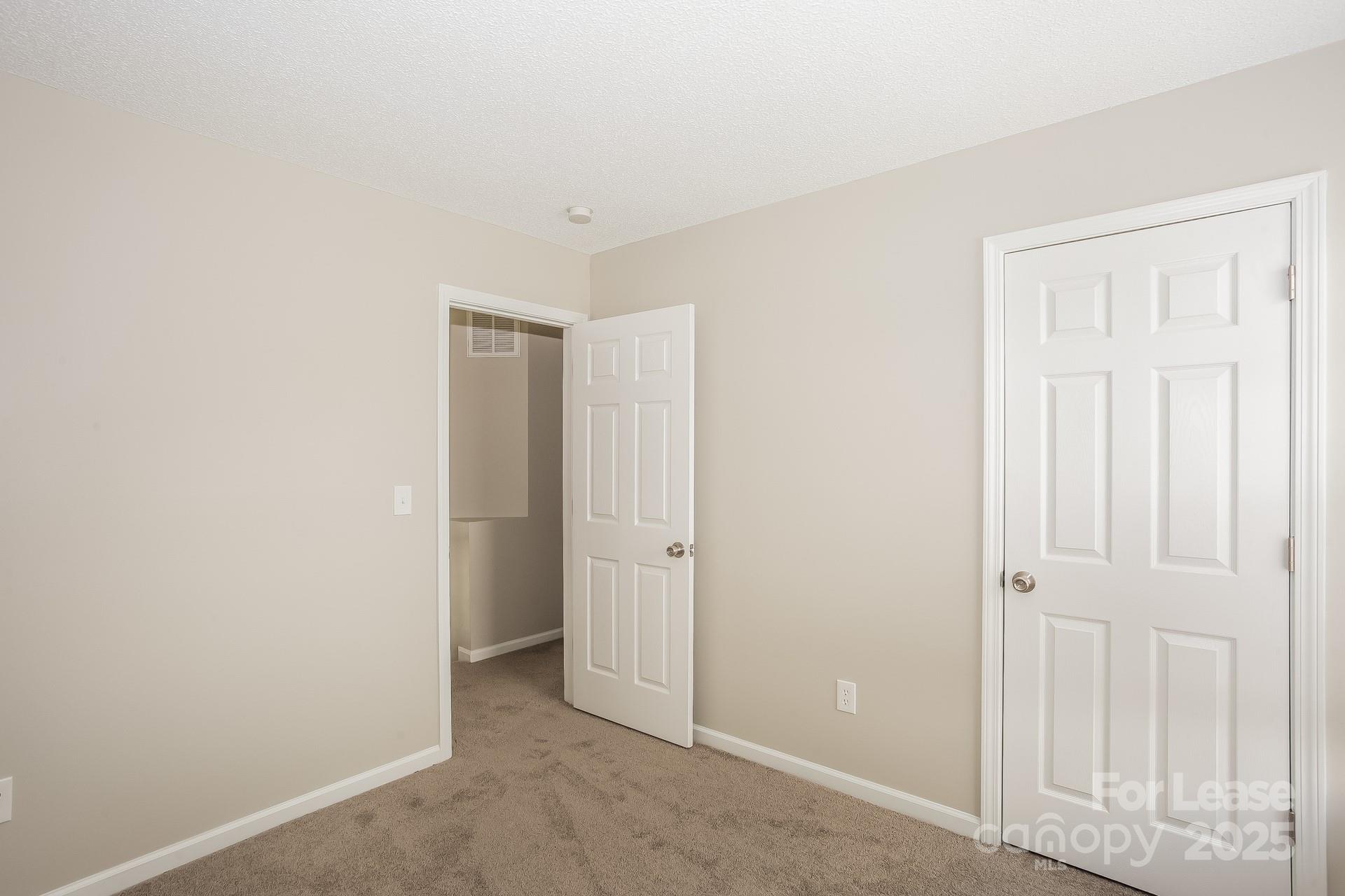 14319 Ruddy Court Charlotte, NC 28273 - Photo 9 of 16 an empty room with windows