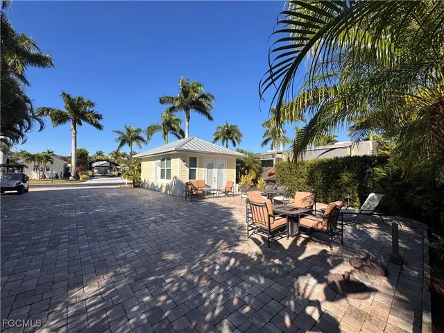 a view of a street with a tree in front of it