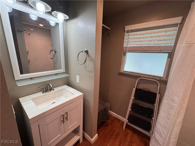 a bathroom with a sink and a mirror