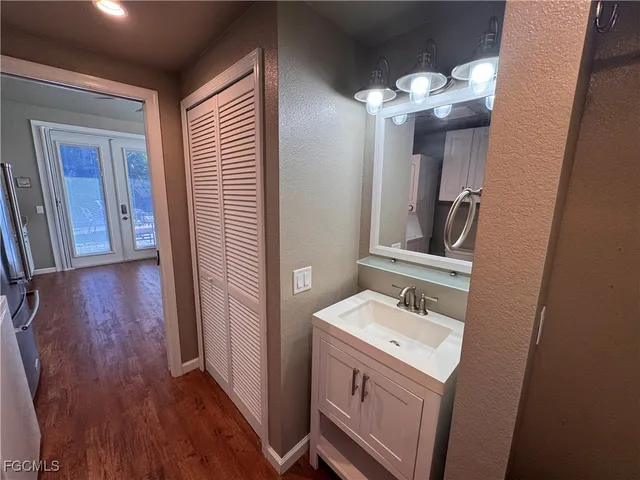 a bathroom with a sink and a mirror