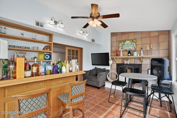 a view of a livingroom with furniture and a flat screen tv