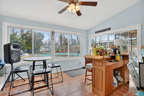 a dining room filled with furniture and window