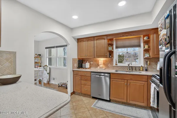 a kitchen with a sink stove and refrigerator