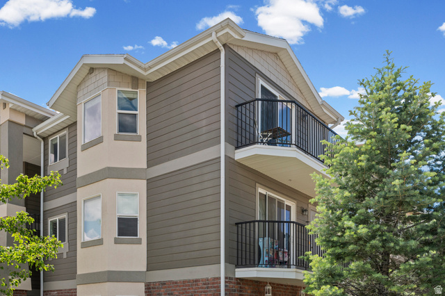 8248 South Resaca Drive, Unit J10 Sandy, UT 84070 - Photo 35 of 40 Multi-story exterior with horizontal siding and brick accents