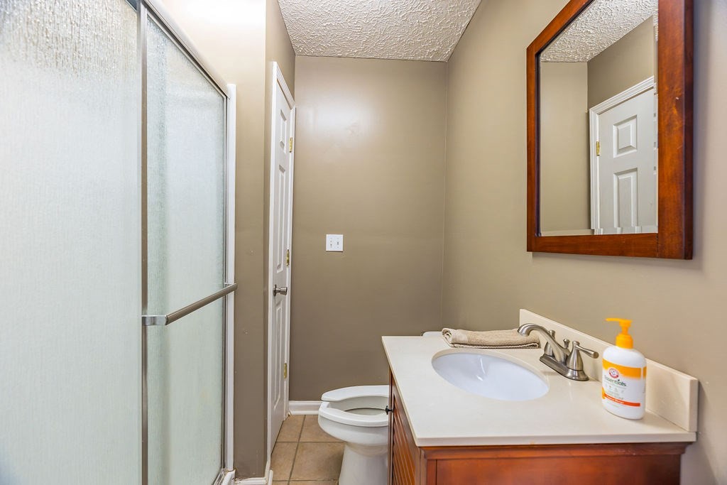 8496 South Madisonville Road Hopkinsville, KY 42240 - Photo 14 of 22 a bathroom with a sink toilet and shower