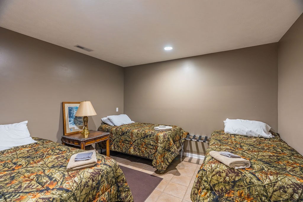 8496 South Madisonville Road Hopkinsville, KY 42240 - Photo 15 of 22 a bedroom with a bed and a lamp