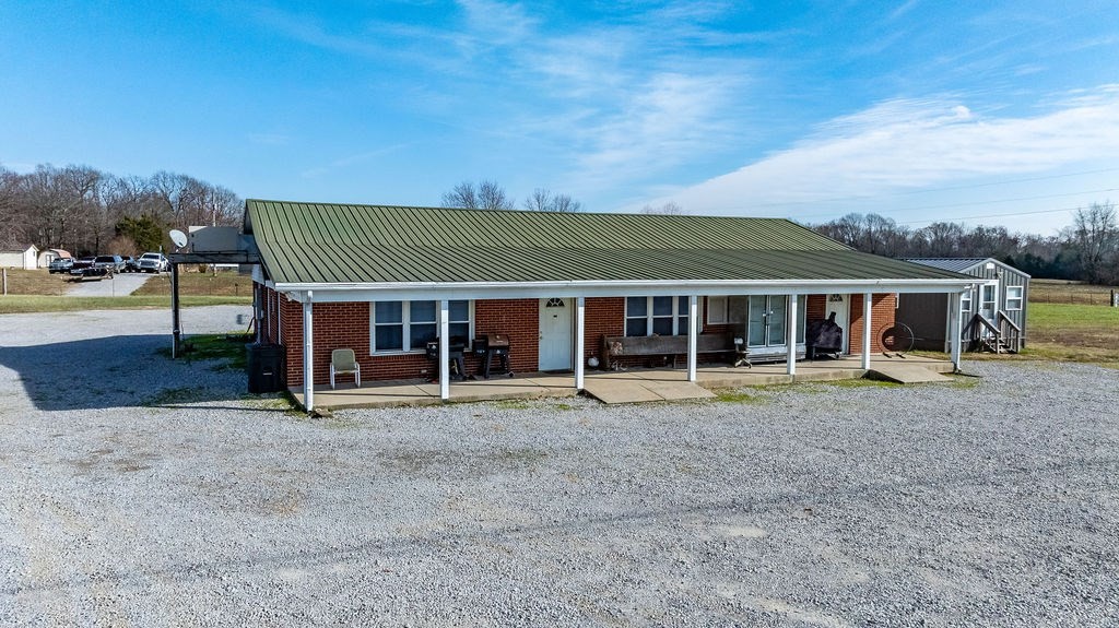 8496 South Madisonville Road Hopkinsville, KY 42240 - Photo 2 of 22 front view of a house with a patio