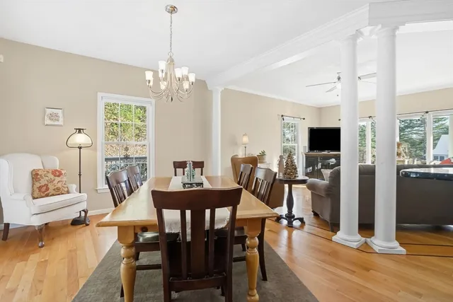 a view of a dining room with furniture window and wooden floor