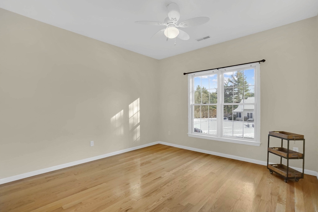 1 Pioneer Drive Palmer, MA 01069 - Photo 20 of 31 a view of an empty room with a window and wooden floor