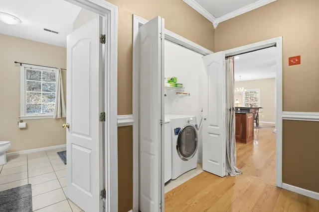 a view of a hallway with washer and dryer
