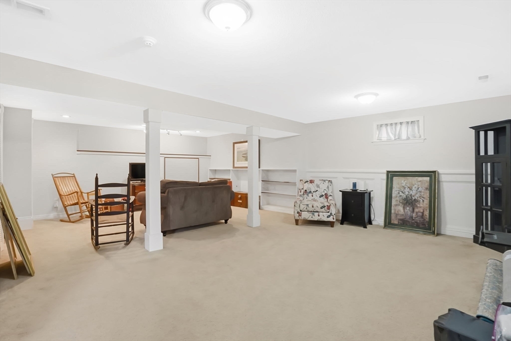 1 Pioneer Drive Palmer, MA 01069 - Photo 26 of 31 a living room with furniture and a refrigerator