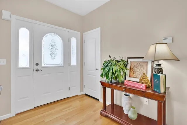 a view of living room with furniture and a potted plant