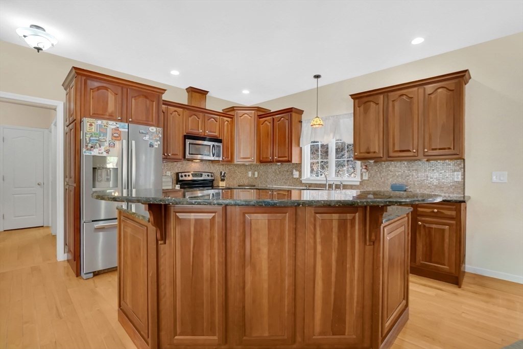 1 Pioneer Drive Palmer, MA 01069 - Photo 6 of 31 a kitchen with stainless steel appliances granite countertop a refrigerator and a stove top oven